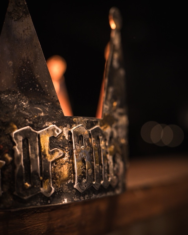 Close detail of the crown band with the lettering Of BNE in brass and steel